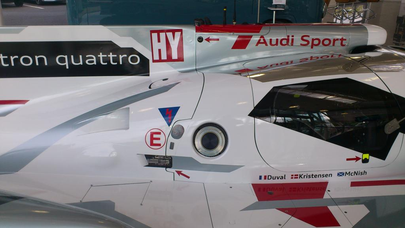 Illustration for article titled Audi R18 E-Tron (was) parked at Volkswagen Financial Services lobby